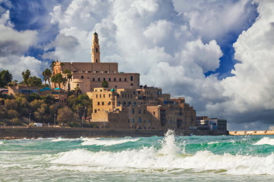 Old town of Jaffa over the sand beach bay on sunset, Tel Aviv, Israel